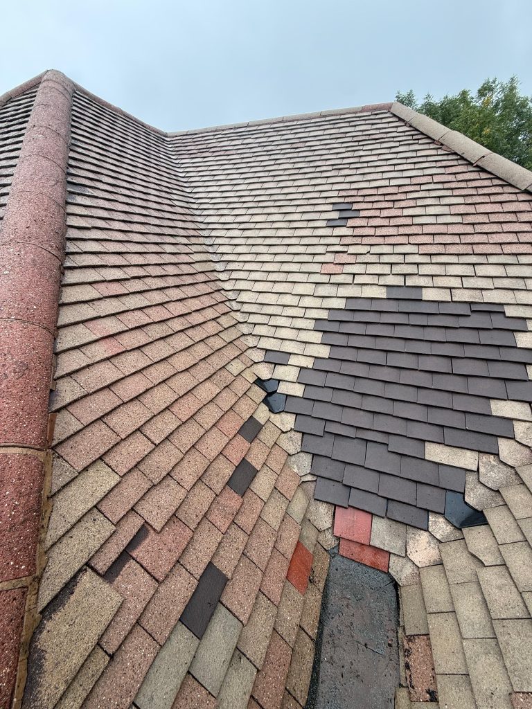 The same tiled roof valley after moss removal and cleaning
